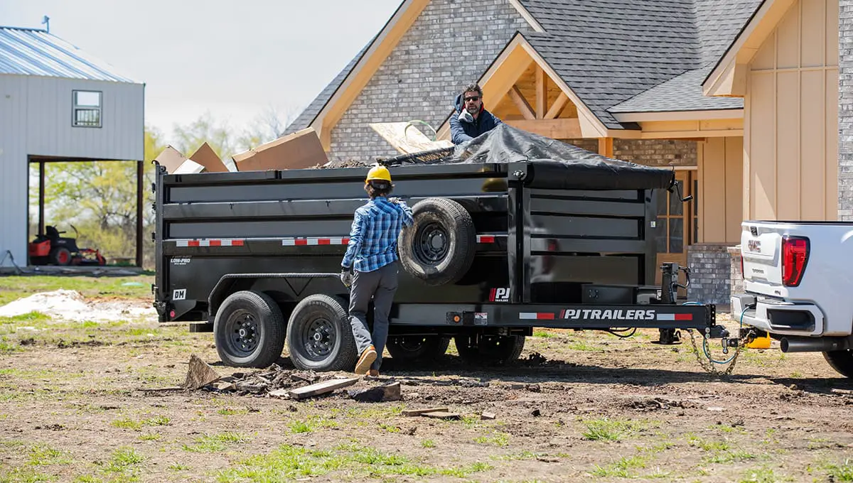 Two workers covering a full load on the 83