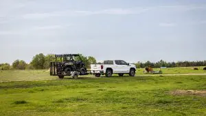 Truck carrying an ATV with the 77