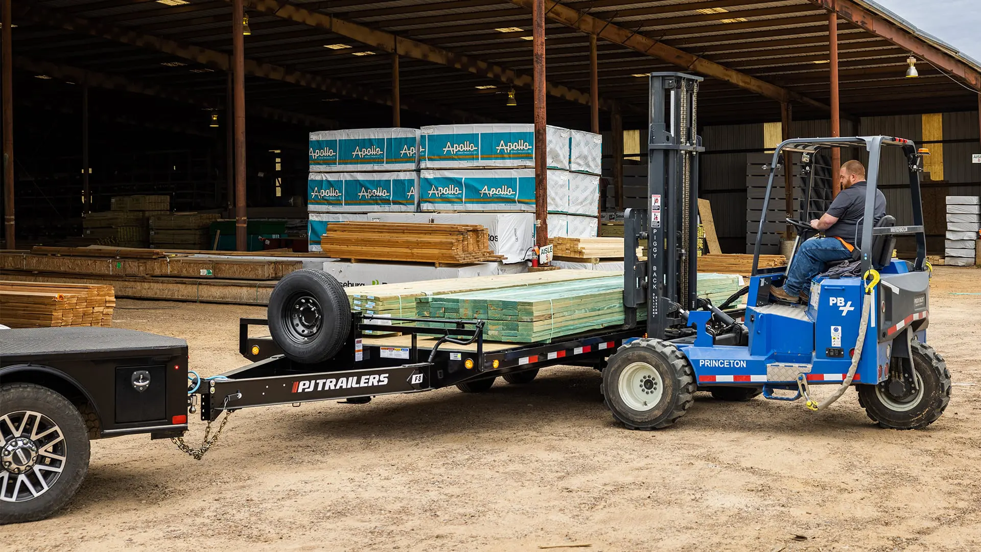 Worker loading wooden planks onto the 8