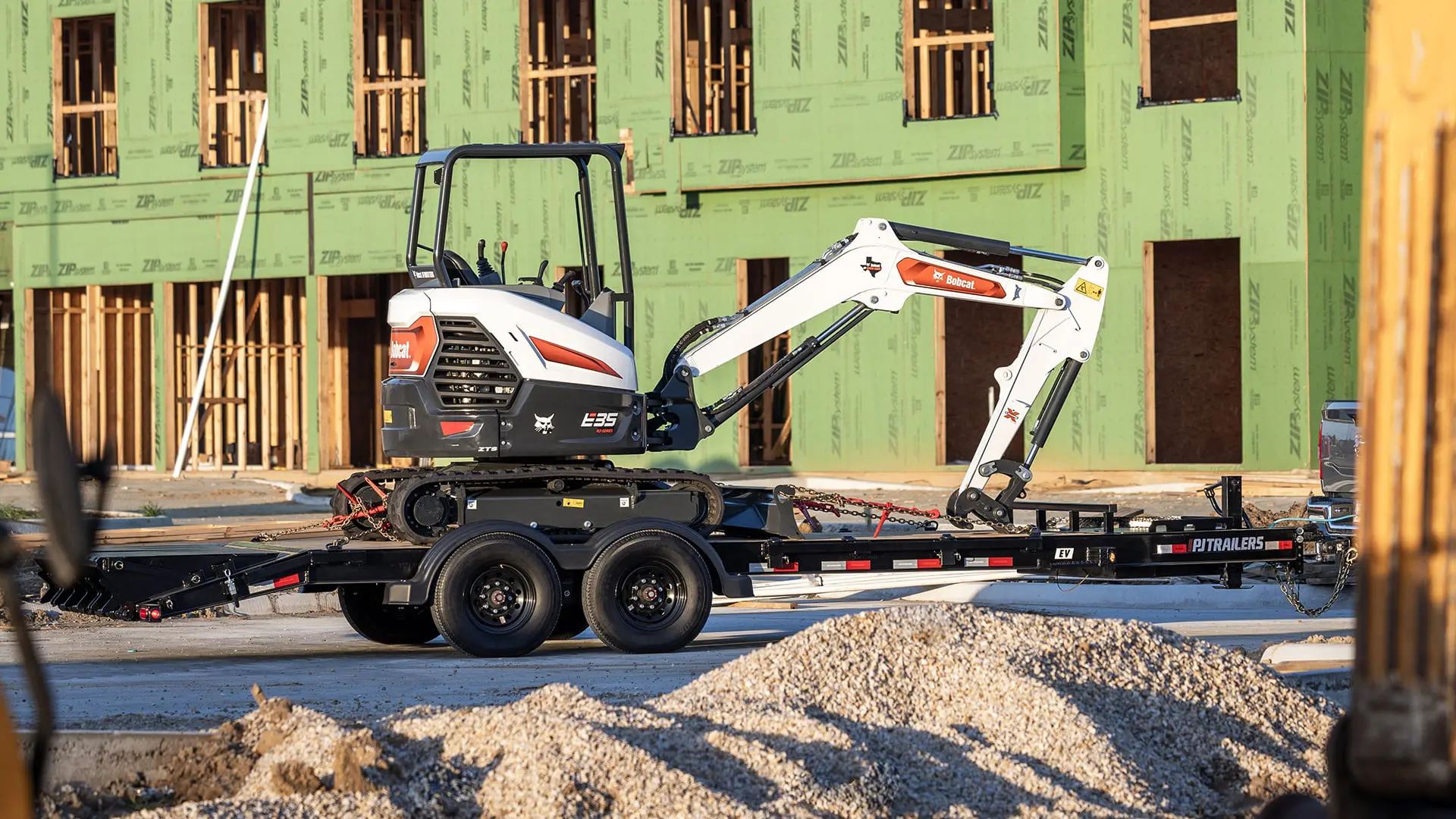 heavy duty trailer carrying construction equipment