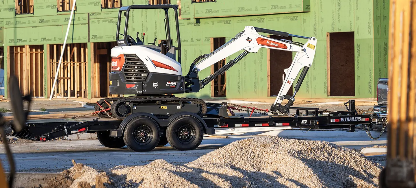 PJ Trailer Hauling Bobcat Construction Equipment