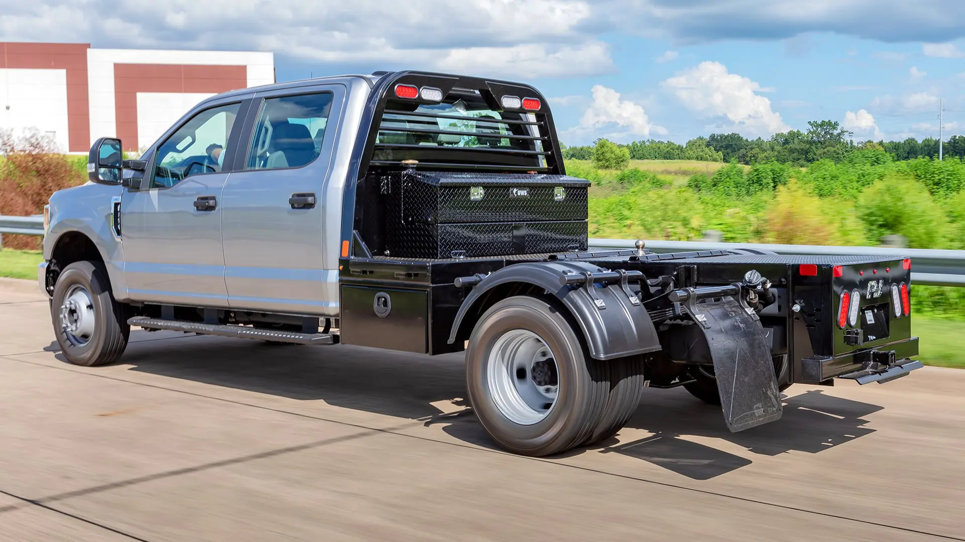 A silver truck with the Hotshot Body (GN) truck bed