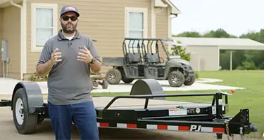 worker standing in front of trailer