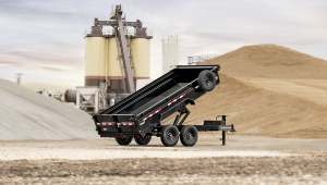 14K Low-Profile Dump PRO Trailer sitting at an aggregate material site