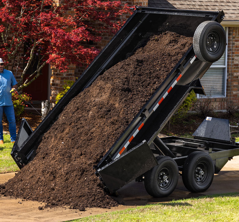 Dump Trailer With Supersized Load of Dirt
