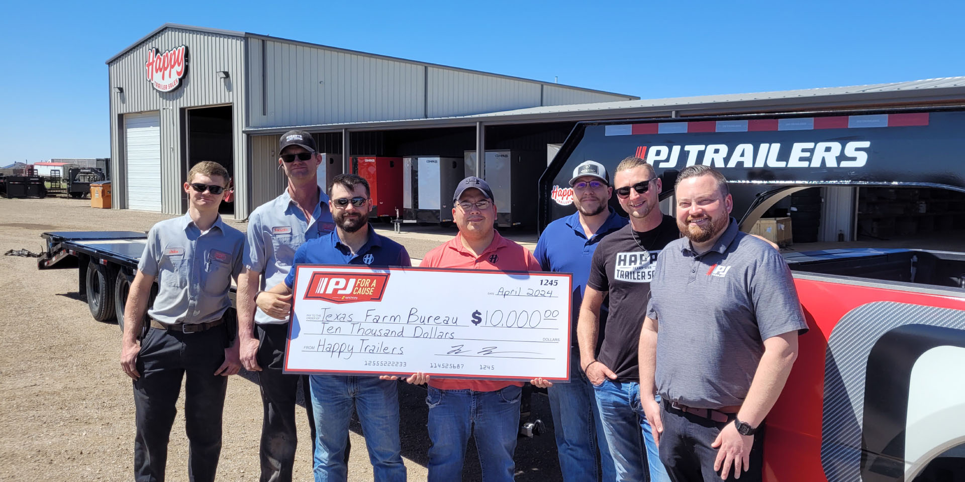 People holding a large check